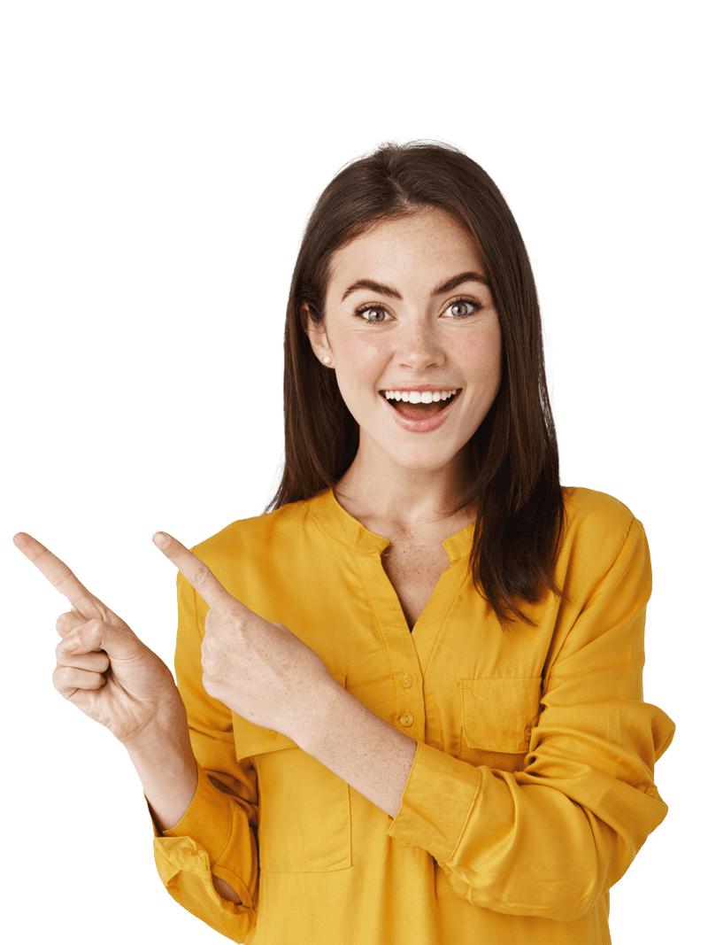 excited-young-woman-showing-banner-pointing-fingers-left-and-smiling-at-camera-standing-amazed-at-white-wall