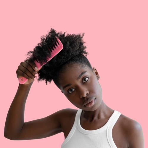 medium-shot-young-woman-styling-hair